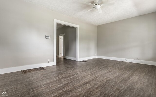 3652 N Kenwood Ave, Indianapolis, IN 46208 - unfurnished room with a ceiling fan, dark wood finished floors, baseboards, and a textured ceiling