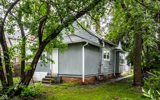 3652 N Kenwood Ave, Indianapolis, IN 46208 - view of property exterior featuring entry steps and a chimney