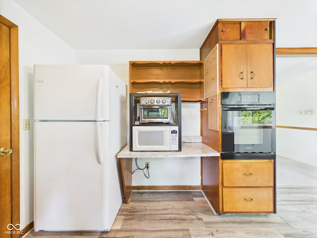 4733 E 100 S, Anderson, IN 46017 - kitchen with white appliances, light wood finished floors, and light countertops