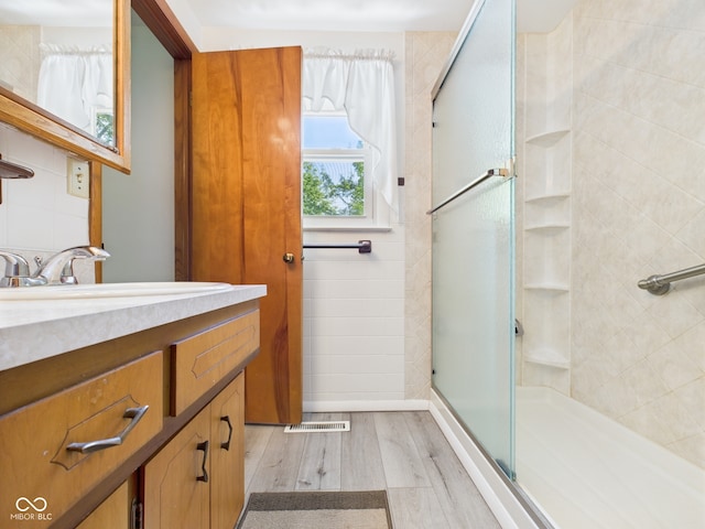 4733 E 100 S, Anderson, IN 46017 - full bathroom with a stall shower, wood finished floors, and vanity