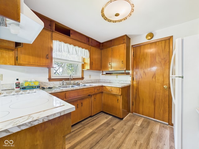 4733 E 100 S, Anderson, IN 46017 - kitchen with white appliances, range hood, a sink, and brown cabinets