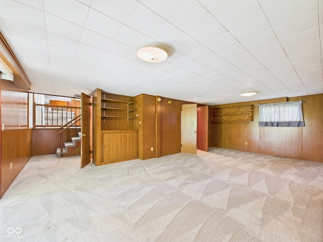 4733 E 100 S, Anderson, IN 46017 - unfurnished room featuring wood walls, carpet flooring, and stairway