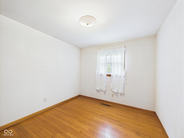 4733 E 100 S, Anderson, IN 46017 - empty room with light wood-style flooring and baseboards