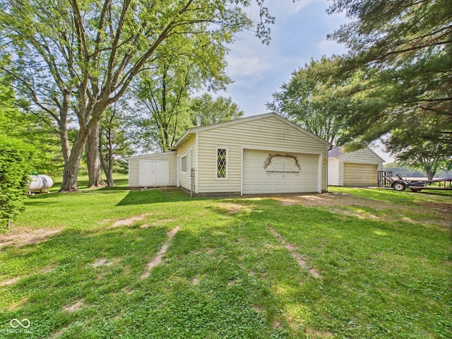 4733 E 100 S, Anderson, IN 46017 - view of property exterior with an outbuilding, a garage, and a lawn