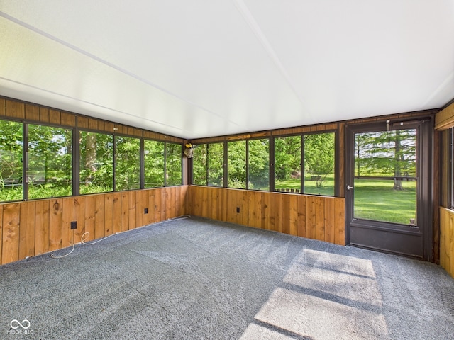 4733 E 100 S, Anderson, IN 46017 - unfurnished sunroom with healthy amount of natural light, carpet, wood walls, and vaulted ceiling