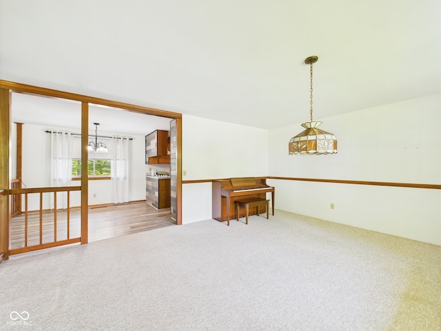 4733 E 100 S, Anderson, IN 46017 - carpeted spare room featuring a chandelier