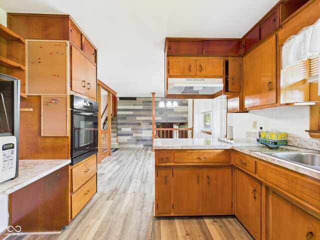 4733 E 100 S, Anderson, IN 46017 - kitchen featuring oven, under cabinet range hood, open shelves, and light countertops