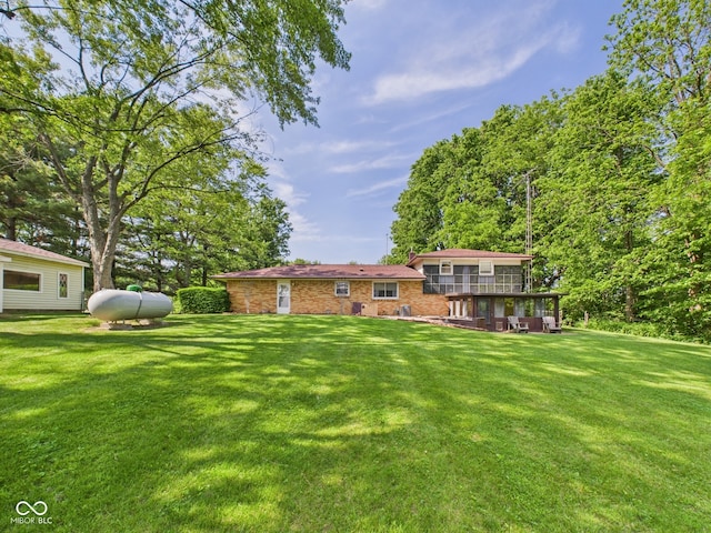 4733 E 100 S, Anderson, IN 46017 - view of green lawn with a wooden deck