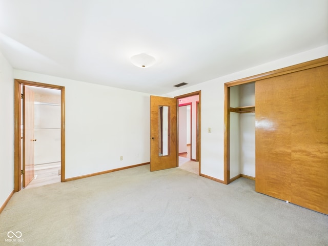 4733 E 100 S, Anderson, IN 46017 - unfurnished bedroom with light carpet, baseboards, and a closet