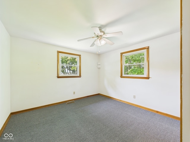 4733 E 100 S, Anderson, IN 46017 - unfurnished room with a ceiling fan, baseboards, and carpet