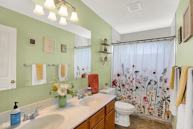 8030 Parcrest Ct, Indianapolis, IN 46259 - bathroom with double vanity, a shower with shower curtain, a chandelier, and a textured ceiling