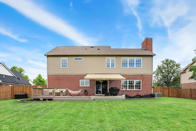 8030 Parcrest Ct, Indianapolis, IN 46259 - back of house with a chimney, brick siding, a fenced backyard, and a deck