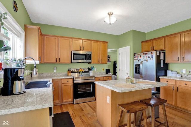 8030 Parcrest Ct, Indianapolis, IN 46259 - kitchen with appliances with stainless steel finishes, light wood finished floors, and light countertops