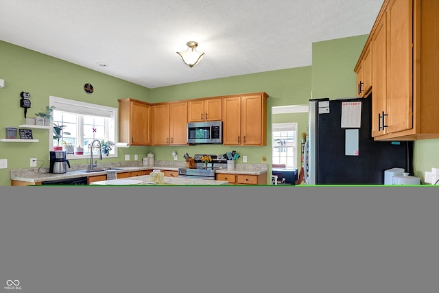 8030 Parcrest Ct, Indianapolis, IN 46259 - kitchen with stainless steel appliances and light countertops