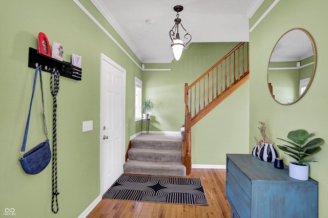 8030 Parcrest Ct, Indianapolis, IN 46259 - entryway featuring wood finished floors, stairs, and crown molding