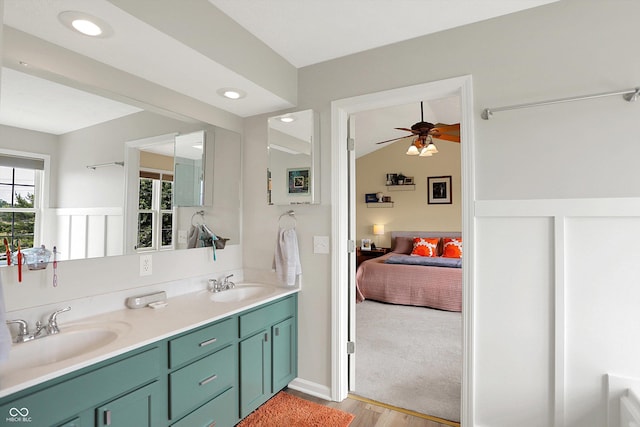 8030 Parcrest Ct, Indianapolis, IN 46259 - bathroom with double vanity, wood finished floors, ceiling fan, ensuite bath, and lofted ceiling