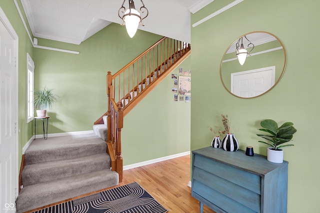 8030 Parcrest Ct, Indianapolis, IN 46259 - stairs with ornamental molding and wood finished floors