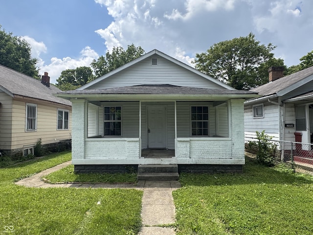 1445 W 34th St, Indianapolis, IN 46208 - view of front of home with brick siding and covered porch