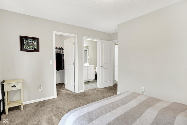 3428 Thomas Jefferson St, Westfield, IN 46074 - bedroom featuring carpet, a walk in closet, baseboards, a closet, and ensuite bath