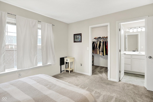 3428 Thomas Jefferson St, Westfield, IN 46074 - bedroom featuring carpet floors, a spacious closet, baseboards, a sink, and a closet