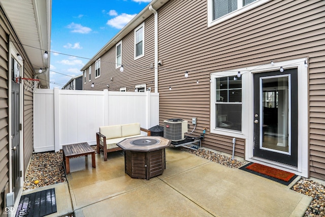 3428 Thomas Jefferson St, Westfield, IN 46074 - view of patio / terrace with central air condition unit and an outdoor living space with a fire pit