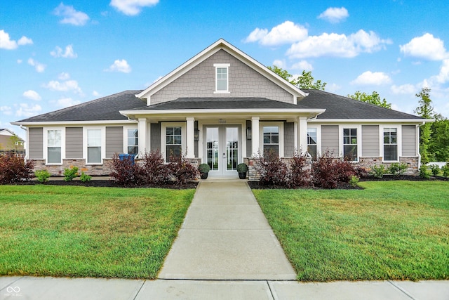 3428 Thomas Jefferson St, Westfield, IN 46074 - craftsman-style home with french doors, a front yard, stone siding, and a porch