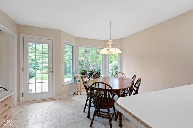 9175 Lakewind Dr, Indianapolis, IN 46256 - dining area with healthy amount of natural light, light tile patterned floors, and a chandelier