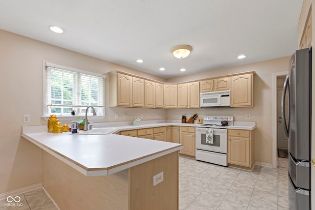 9175 Lakewind Dr, Indianapolis, IN 46256 - kitchen with white appliances, light brown cabinets, a peninsula, and recessed lighting