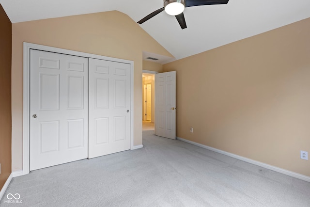 9175 Lakewind Dr, Indianapolis, IN 46256 - unfurnished bedroom with vaulted ceiling, light carpet, a closet, and ceiling fan