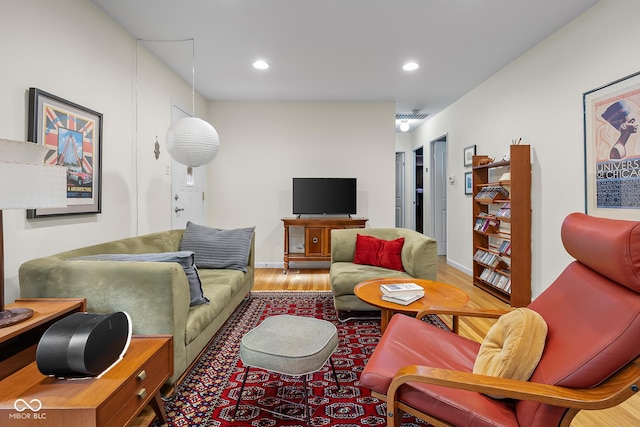 2233 Washington St, Columbus, IN 47201 - living room featuring wood finished floors and recessed lighting