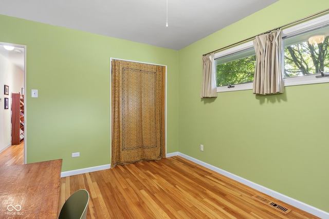 2233 Washington St, Columbus, IN 47201 - unfurnished bedroom featuring baseboards and light wood finished floors