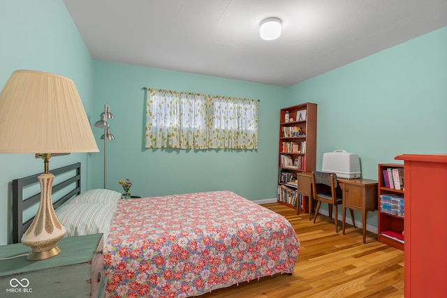 2233 Washington St, Columbus, IN 47201 - bedroom with wood finished floors and baseboards