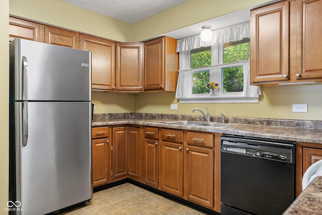 2233 Washington St, Columbus, IN 47201 - kitchen featuring freestanding refrigerator, dishwasher, a sink, and brown cabinets