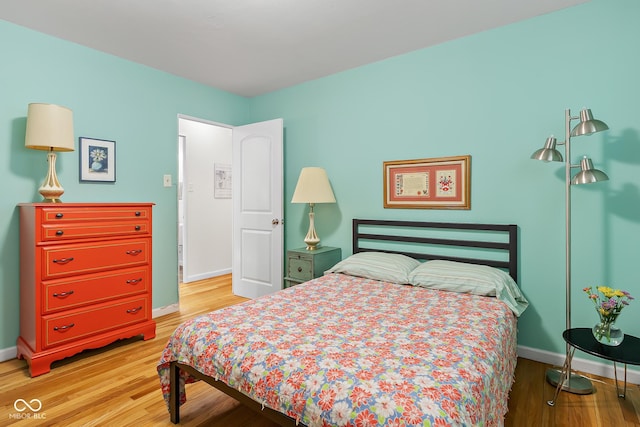 2233 Washington St, Columbus, IN 47201 - bedroom with light wood-type flooring and baseboards