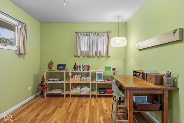 2233 Washington St, Columbus, IN 47201 - rec room with wood finished floors and baseboards