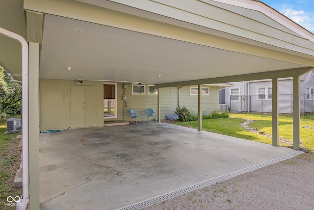 2233 Washington St, Columbus, IN 47201 - view of patio / terrace with central AC unit and a carport