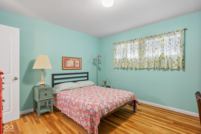 2233 Washington St, Columbus, IN 47201 - bedroom with baseboards and wood finished floors