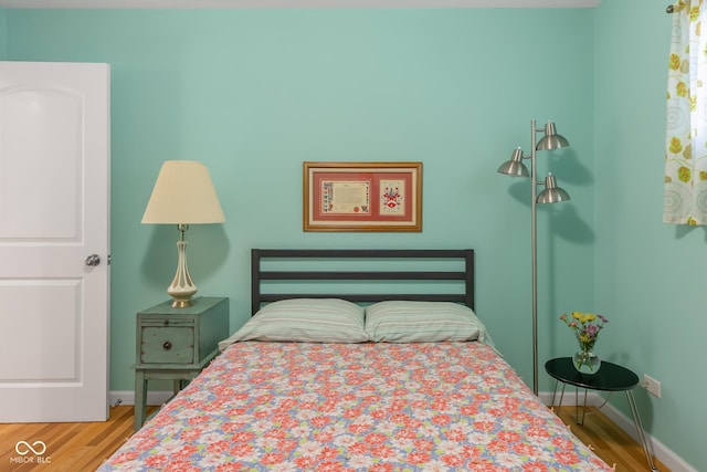 2233 Washington St, Columbus, IN 47201 - bedroom with wood finished floors and baseboards