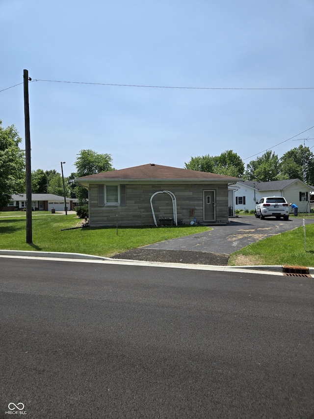 104 Meadow Ln, North Vernon, IN 47265 - single story home with asphalt driveway and a front yard