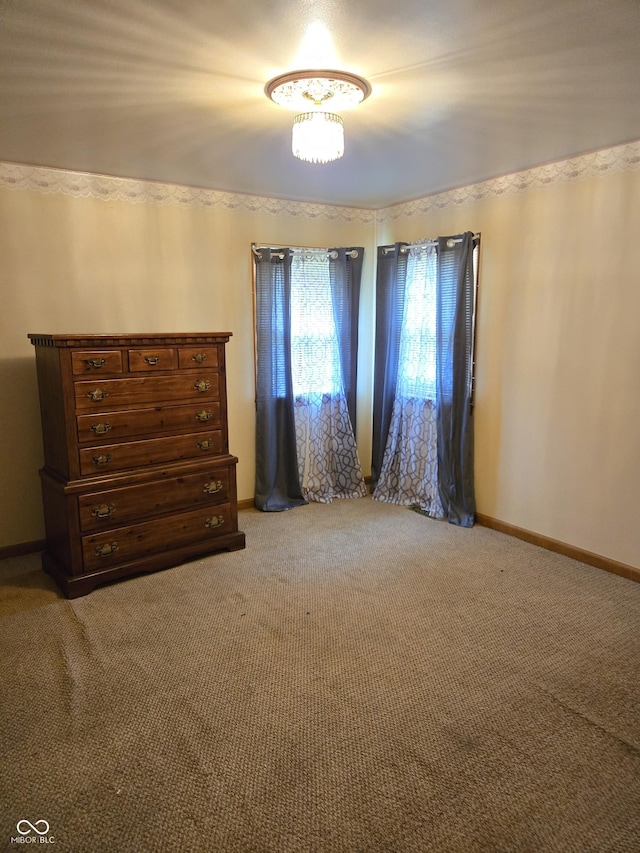 104 Meadow Ln, North Vernon, IN 47265 - spare room featuring light carpet and baseboards