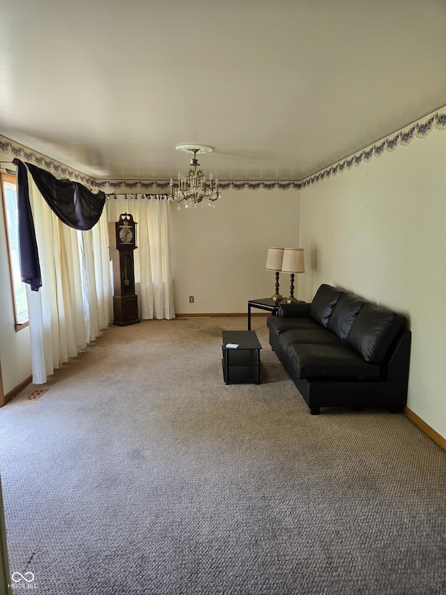104 Meadow Ln, North Vernon, IN 47265 - living area with a chandelier, baseboards, and light carpet