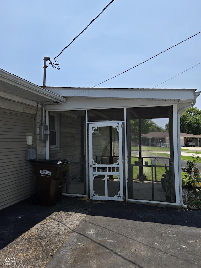 104 Meadow Ln, North Vernon, IN 47265 - view of patio / terrace with a sunroom