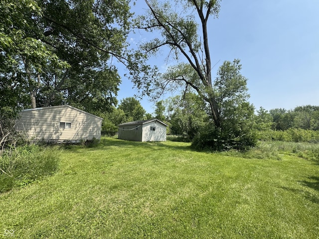 5159 E Edgewood Ave, Indianapolis, IN 46237 - view of grassy yard featuring an outdoor structure
