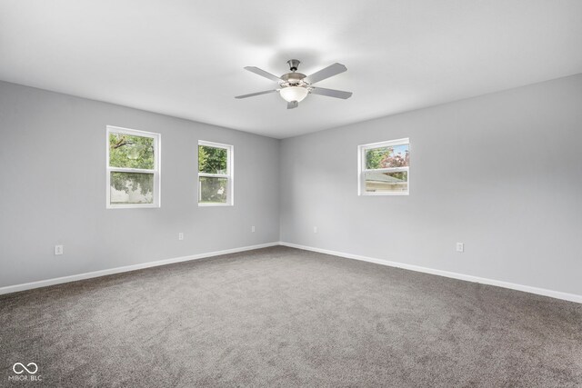 110 E Mcdonald St, Brazil, IN 47834 - unfurnished room with ceiling fan, carpet, and baseboards