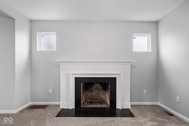110 E Mcdonald St, Brazil, IN 47834 - detailed view of a fireplace with flush hearth, carpet flooring, and baseboards