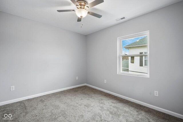 110 E Mcdonald St, Brazil, IN 47834 - spare room with carpet floors, ceiling fan, and baseboards