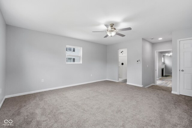 110 E Mcdonald St, Brazil, IN 47834 - unfurnished room with carpet flooring, ceiling fan, baseboards, recessed lighting, and a chandelier
