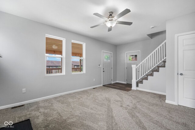 110 E Mcdonald St, Brazil, IN 47834 - entryway featuring stairway, carpet flooring, healthy amount of natural light, and a ceiling fan