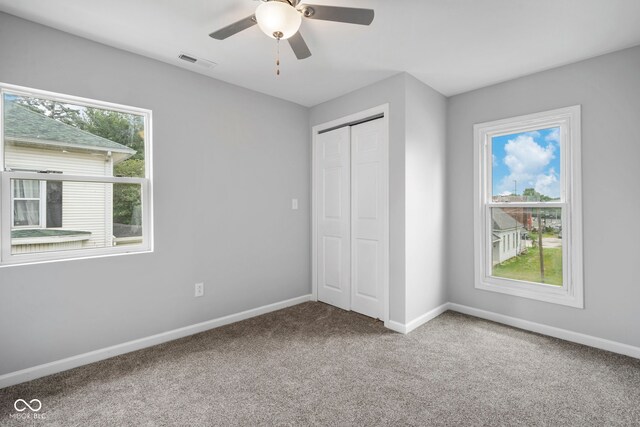 110 E Mcdonald St, Brazil, IN 47834 - unfurnished bedroom featuring carpet flooring, baseboards, a closet, and a ceiling fan
