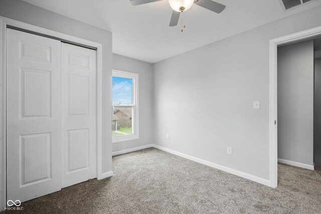 110 E Mcdonald St, Brazil, IN 47834 - unfurnished bedroom featuring carpet flooring, baseboards, a closet, and a ceiling fan